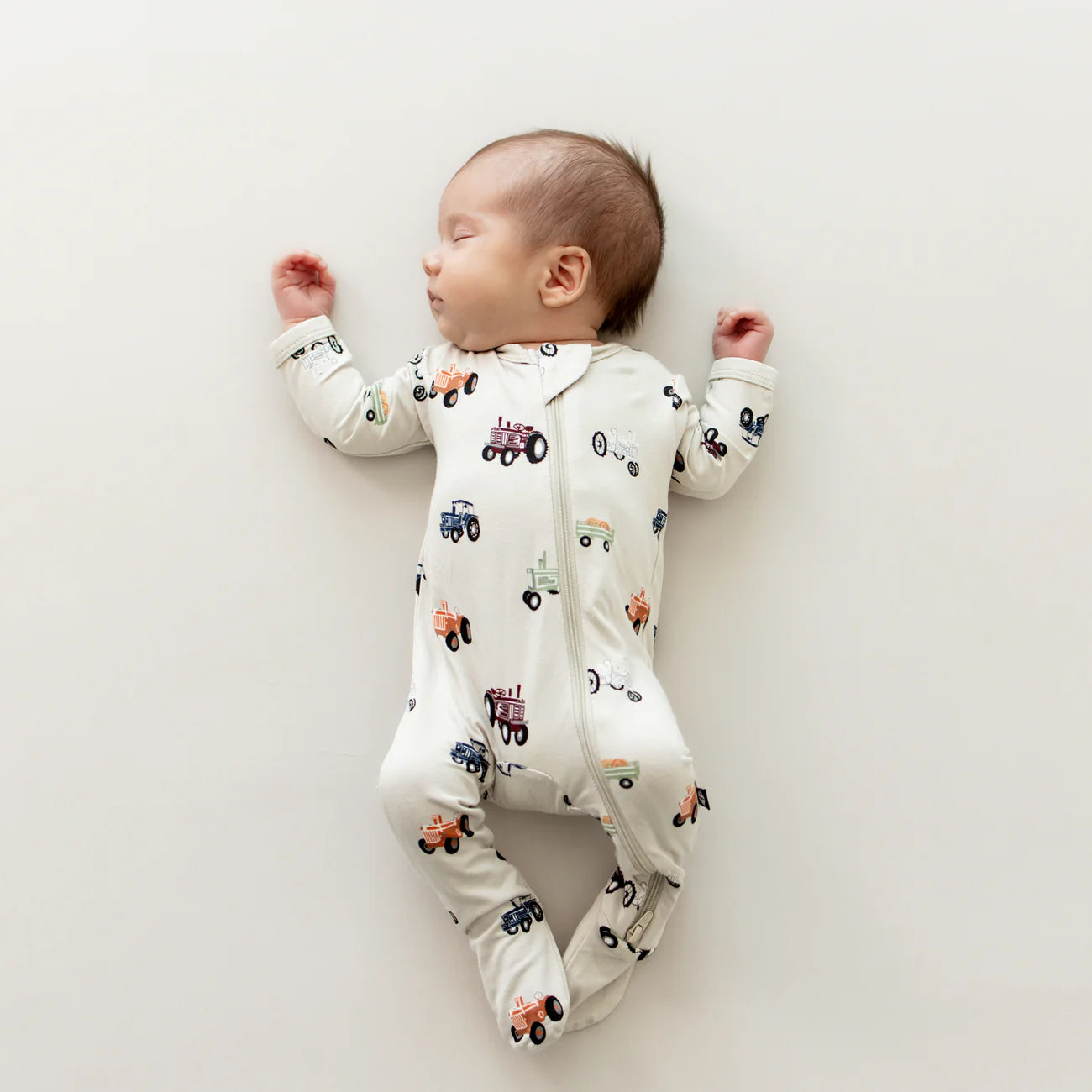 Kyte Baby Zippered Footie || Tractor